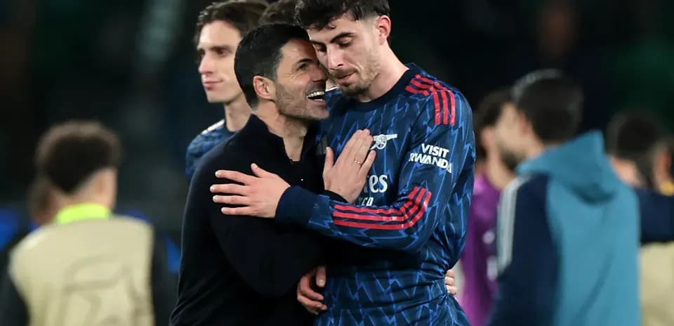Coach embracing player after match celebration