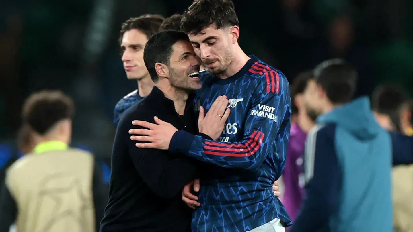 Coach embracing player after match celebration
