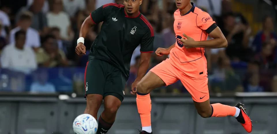Two players competing for the ball on field