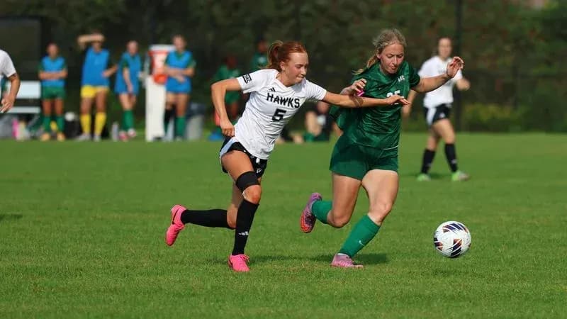 Player competing for the ball during soccer match