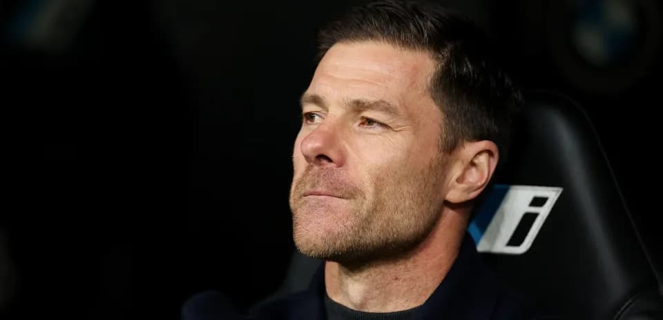 Coach sitting on the bench during a match