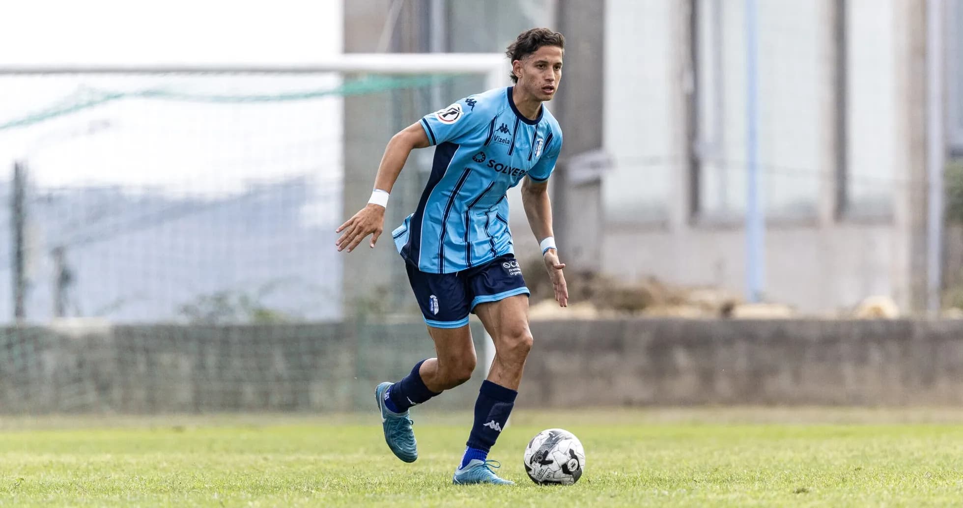 Vizela U23 player dribbling during match