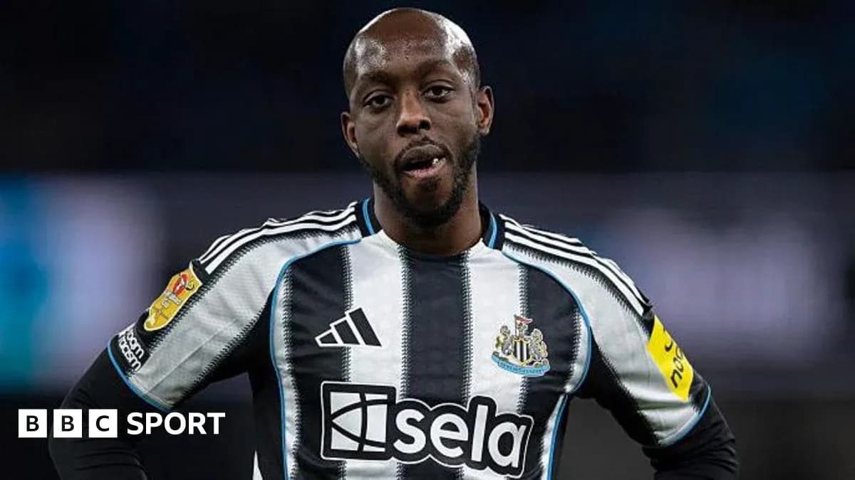 Newcastle player wearing black and white striped jersey