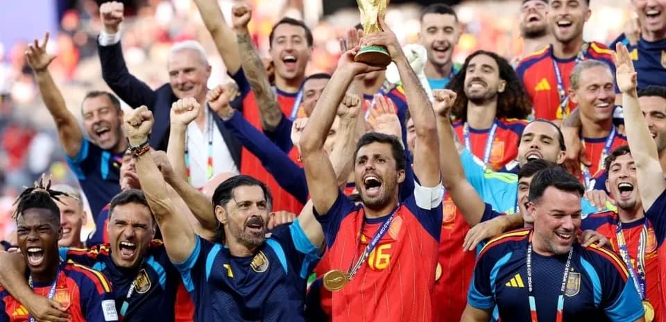 Spain team celebrating with the World Cup trophy