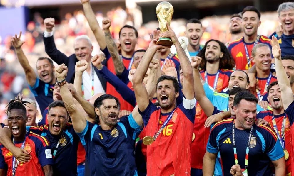 Spain team celebrating with the World Cup trophy