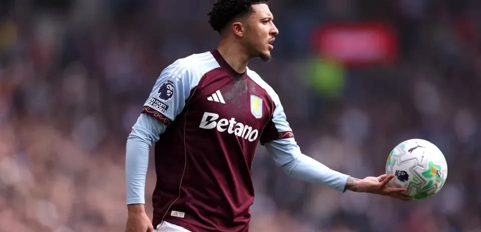 Player in Aston Villa kit preparing to throw ball