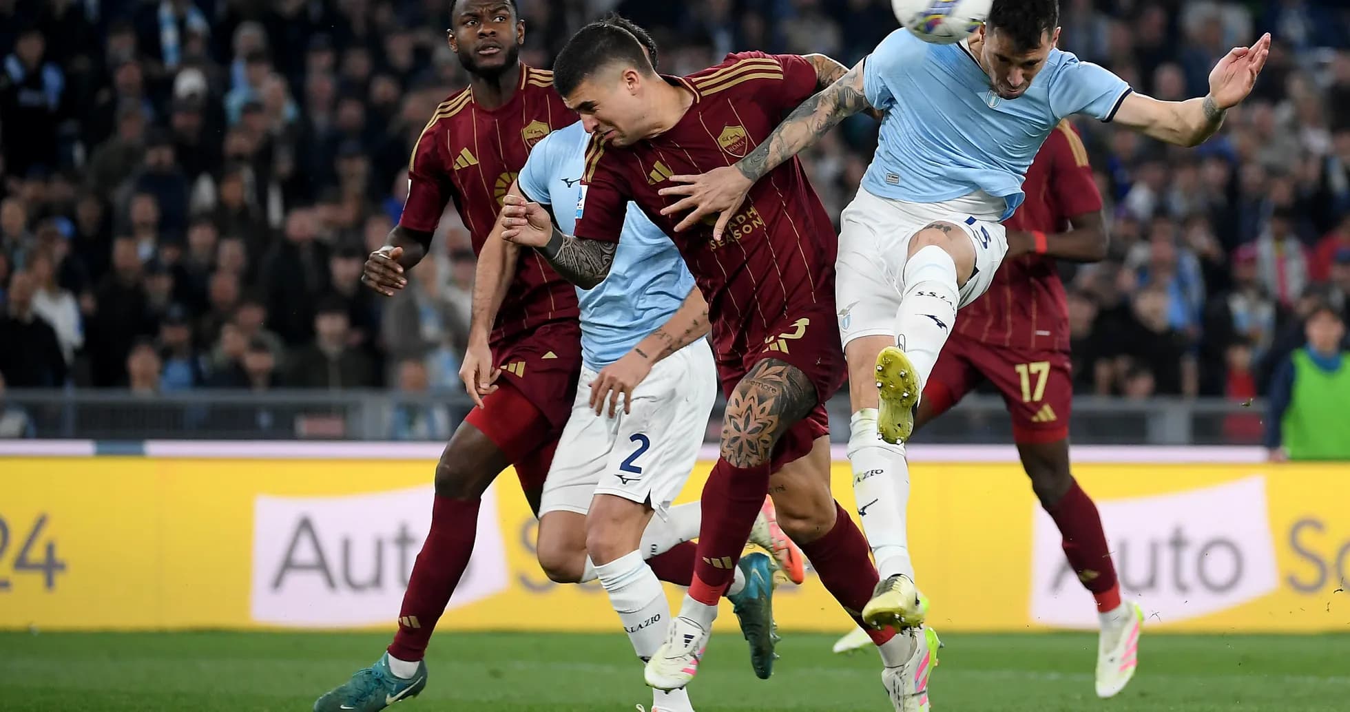AS Roma players contesting a ball against Lazio