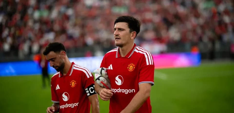 Bruno Fernandes and Harry Maguire walking off the pitch