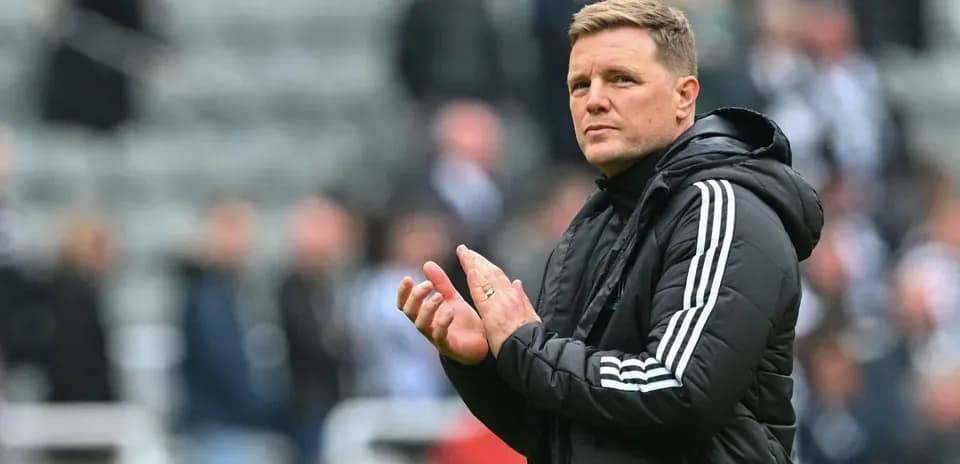 Coach clapping during a match at the stadium
