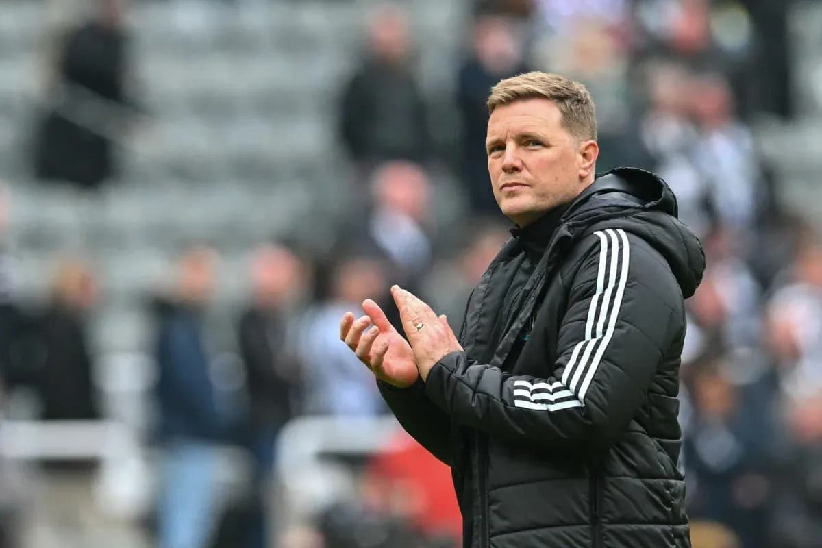 Coach clapping during a match at the stadium