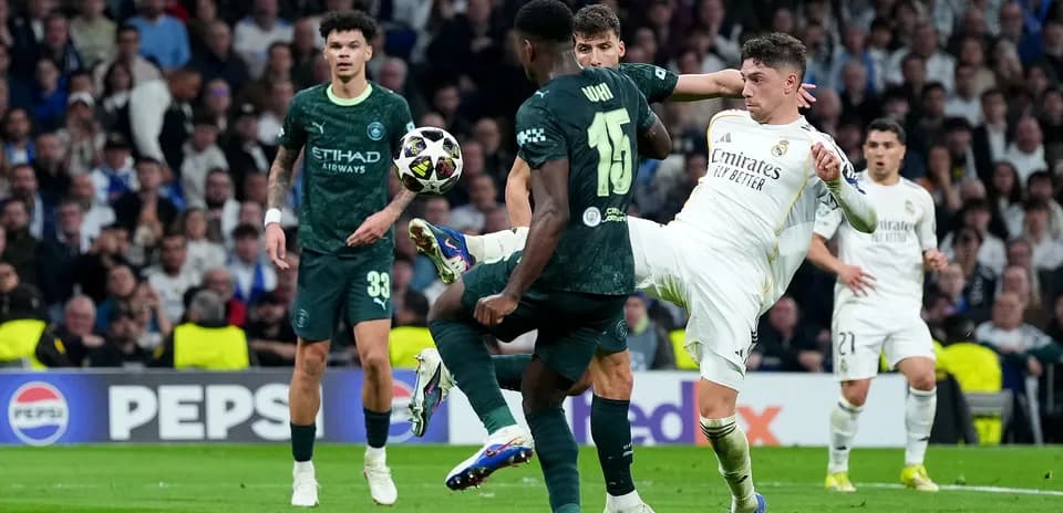 Players battling for the ball in UEFA match