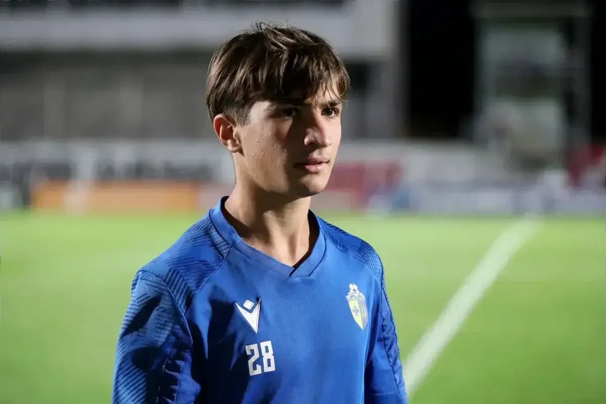 Young player in blue jersey on football pitch