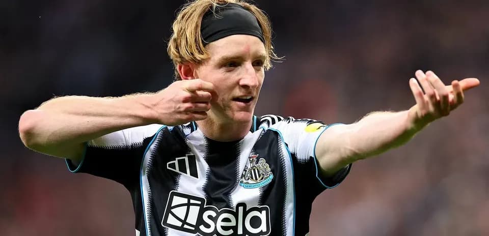 Newcastle player celebrating a goal on the pitch