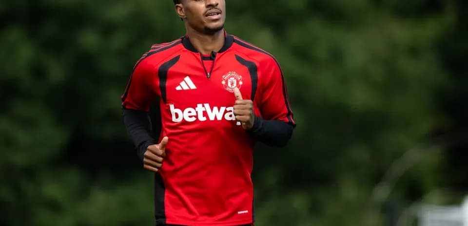 Player running during training session in red kit