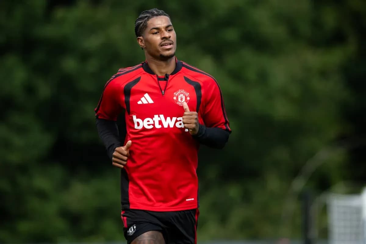 Player running during training session in red kit