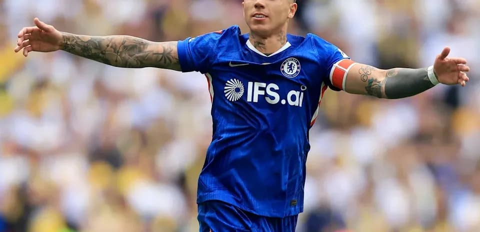 Player celebrating in Chelsea's blue kit on field