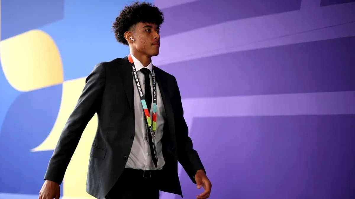 Player arriving in suit with FIFA World Cup lanyard
