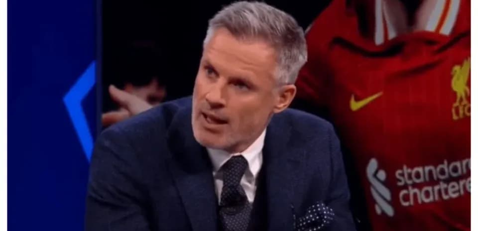 Analyst discussing football on set with Liverpool background