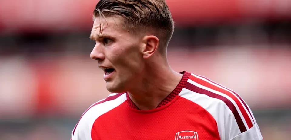 Player wearing Arsenal jersey during match