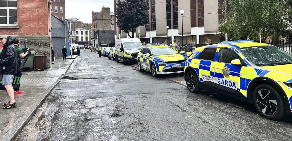 Garda vehicles lined up on a city street