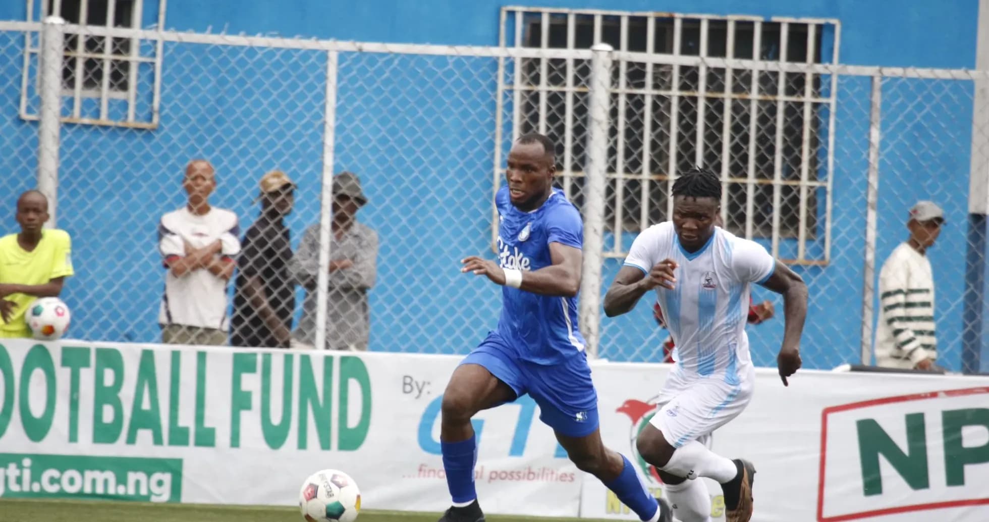 Enyimba player chasing the ball against Sporting Lagos