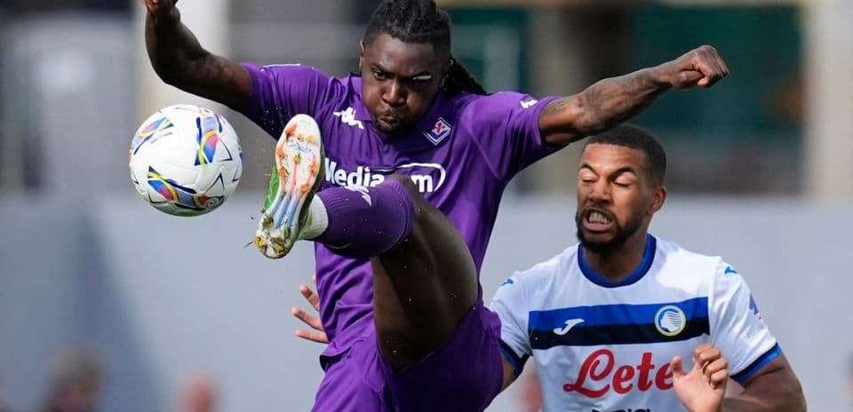 Fiorentina player striking the ball during match