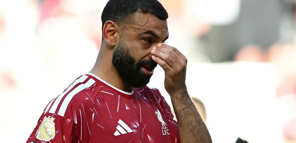 Player adjusting his face during match action