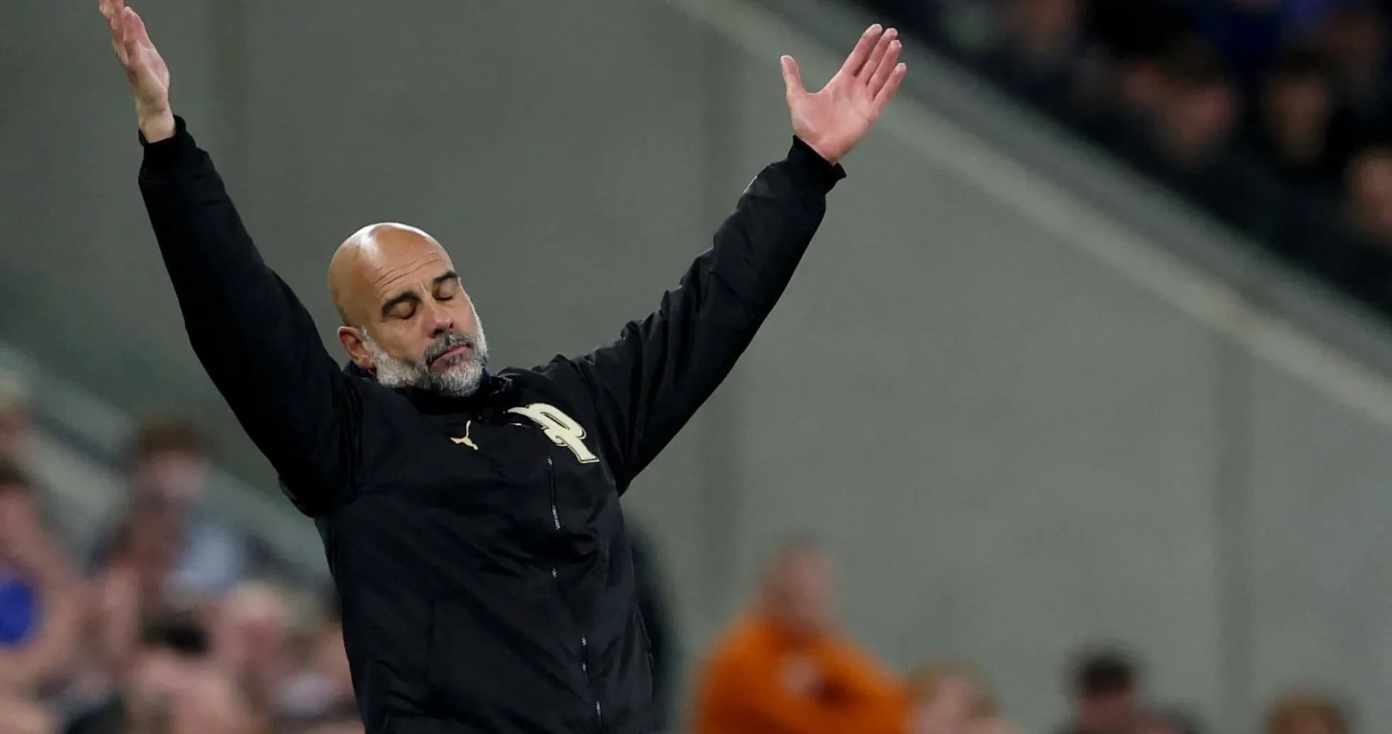 Coach gesturing during a football match