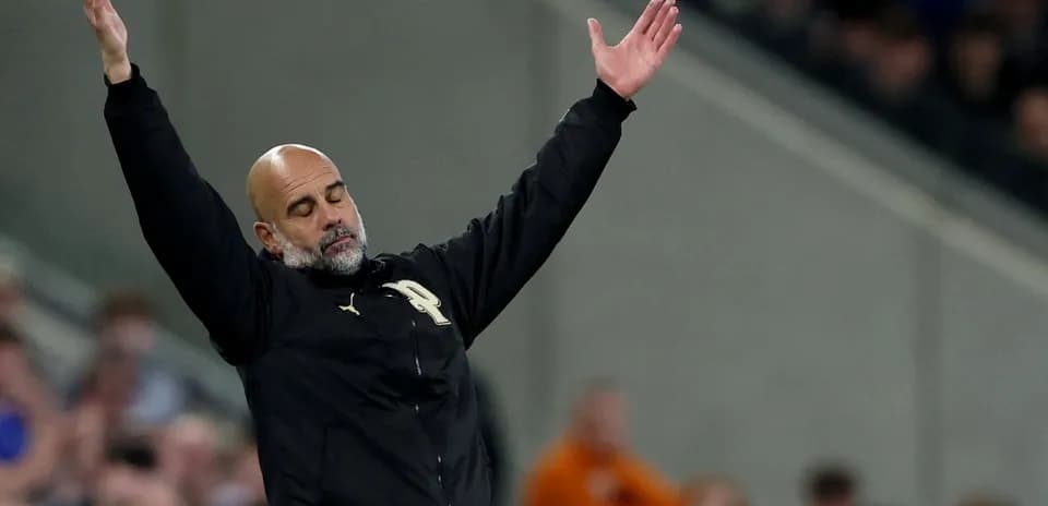Coach gesturing during a football match