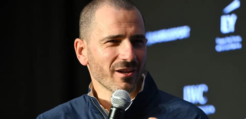 Man speaking into microphone at event