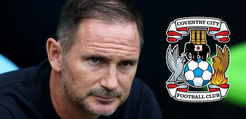 Manager focused during match with club logo