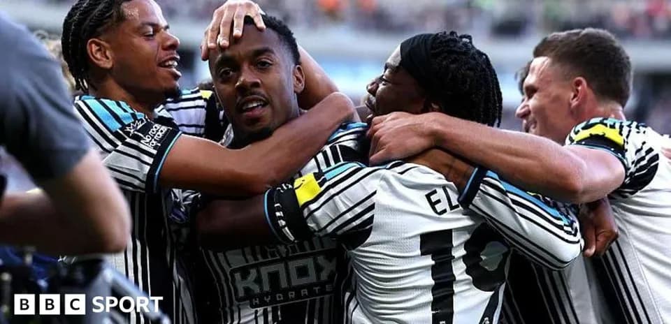 Players celebrating together after scoring a goal