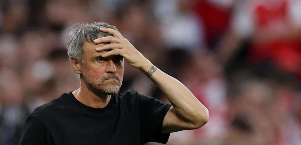 Manager looking concerned during a match