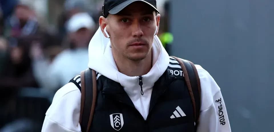 Player arriving at stadium wearing casual attire