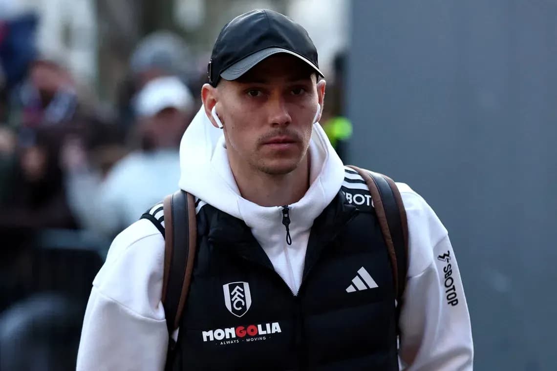 Player arriving at stadium wearing casual attire