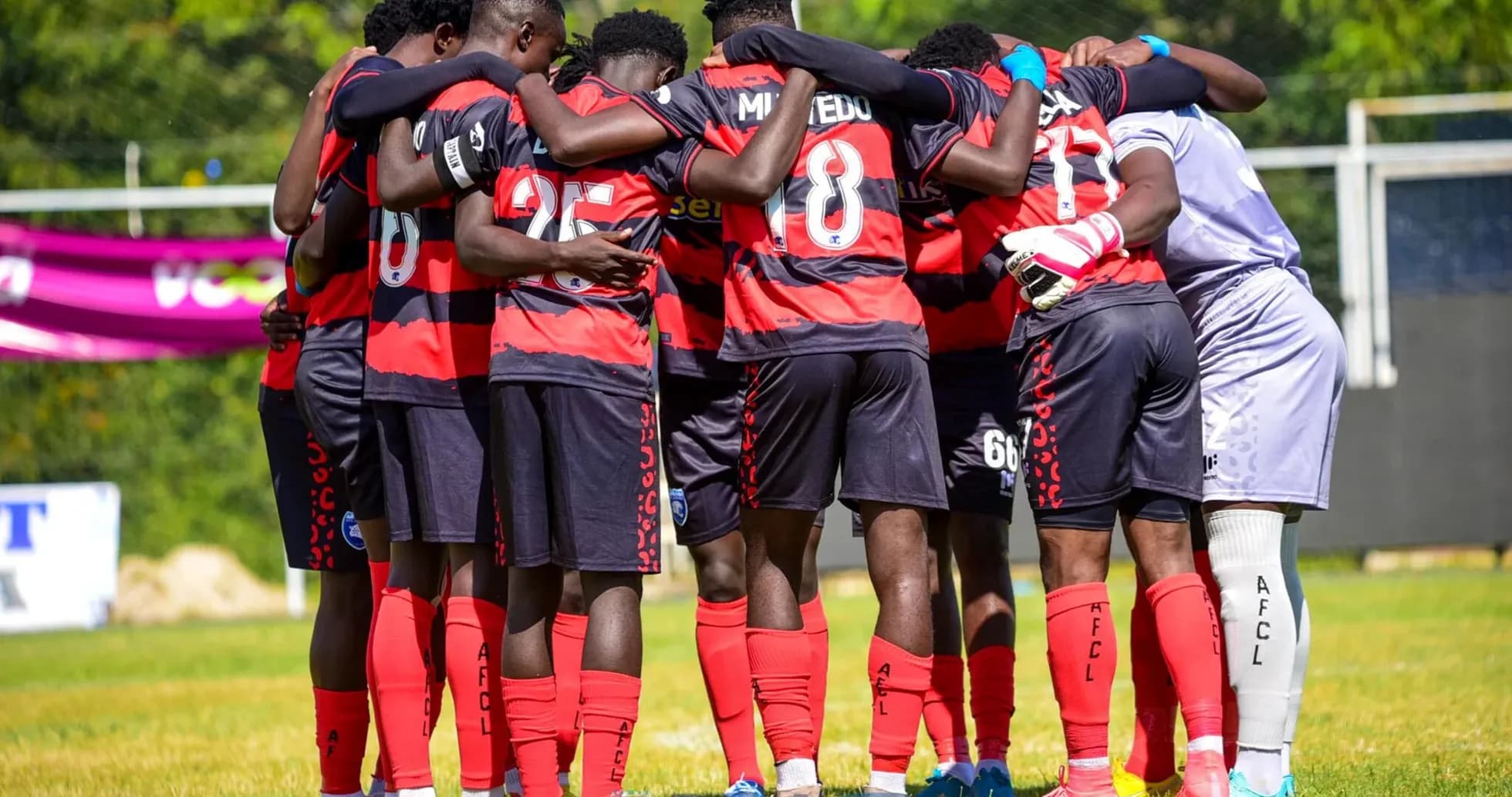 AFC Leopards players in a team huddle