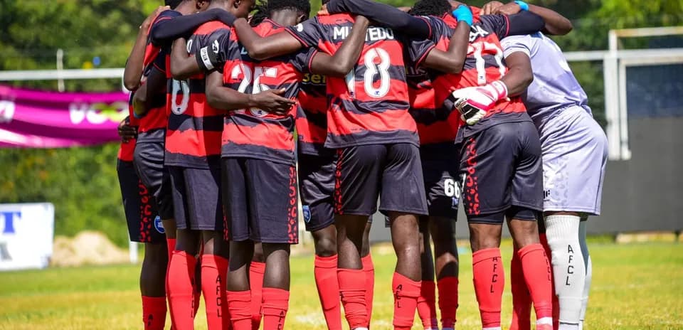 AFC Leopards players in a team huddle