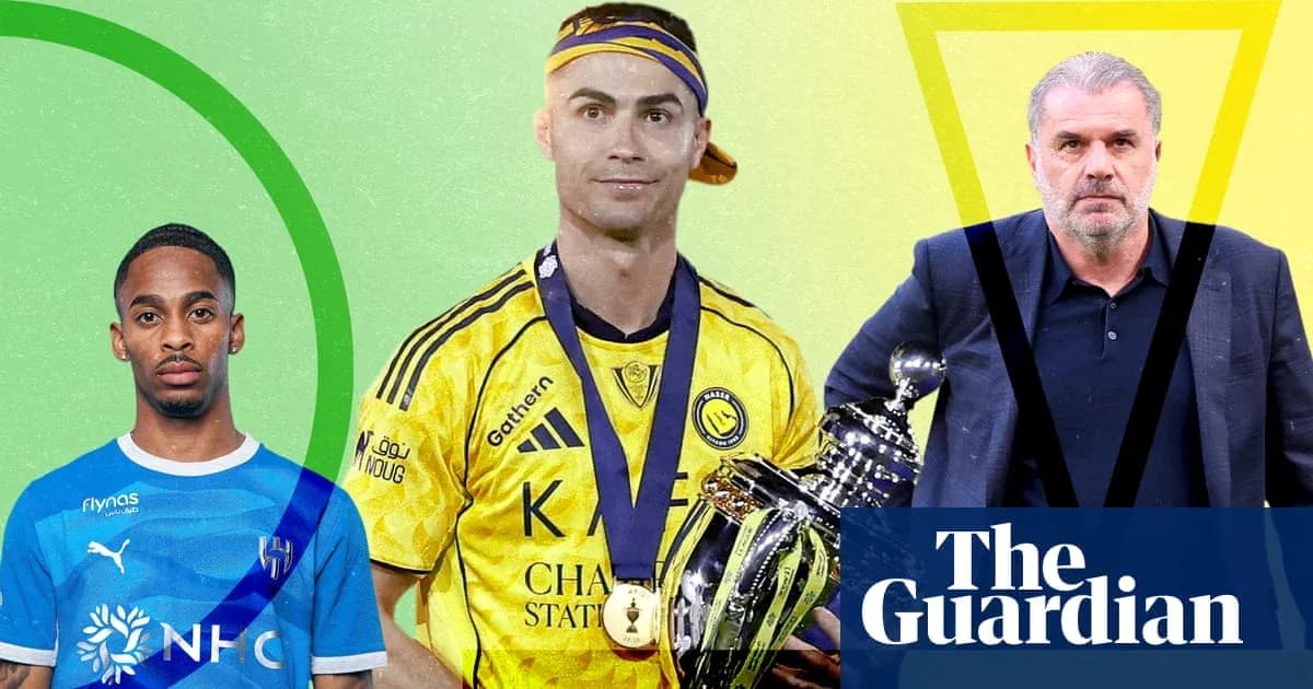 Three football figures posing with a trophy