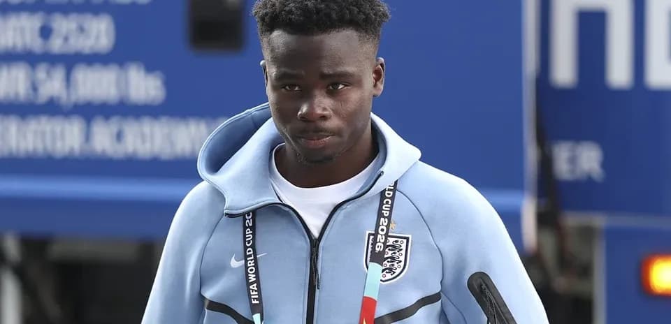 Player wearing England team tracksuit arriving at venue