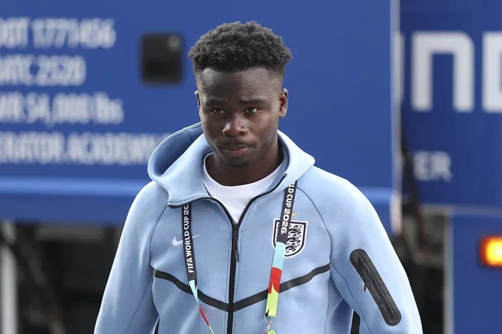 Player wearing England team tracksuit arriving at venue