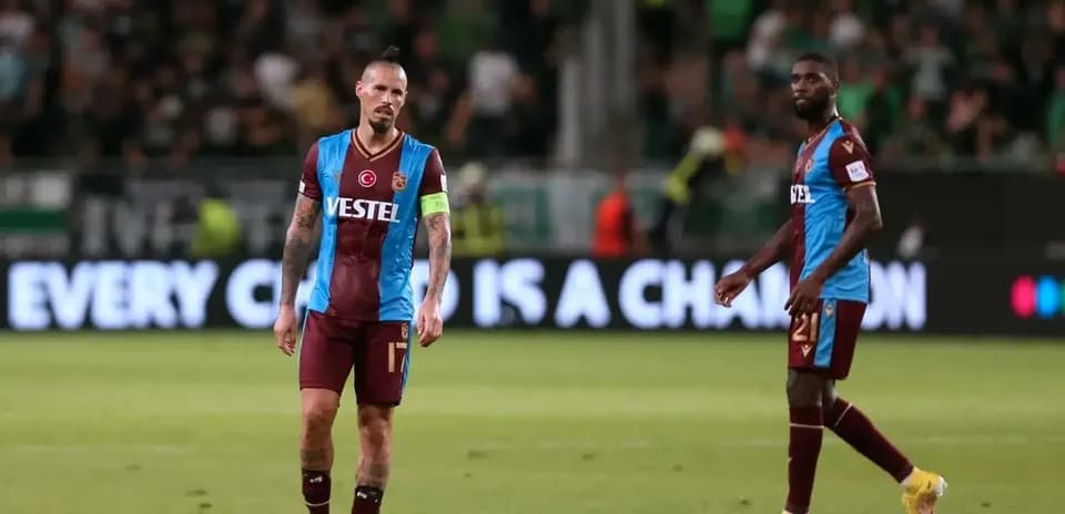 Trabzonspor players walking off the pitch