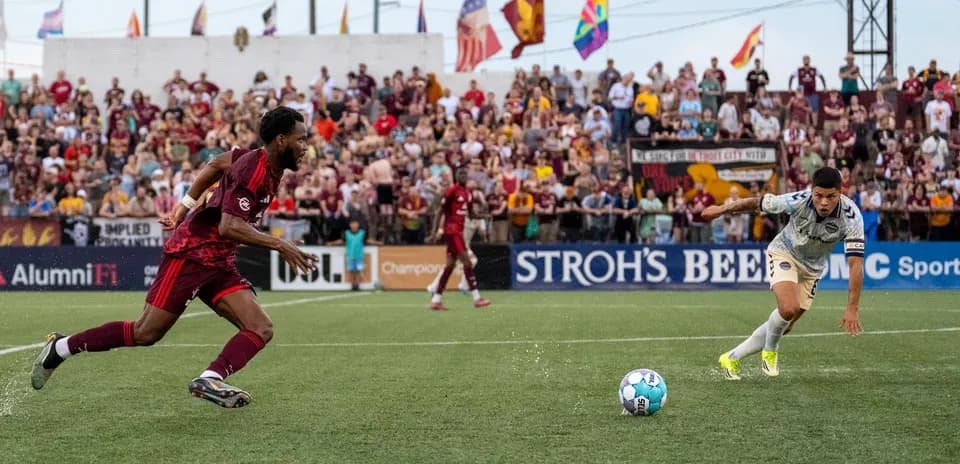 Players competing for the ball in USL match