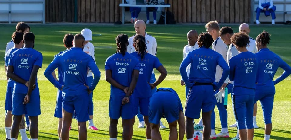 France national team players in training session huddle