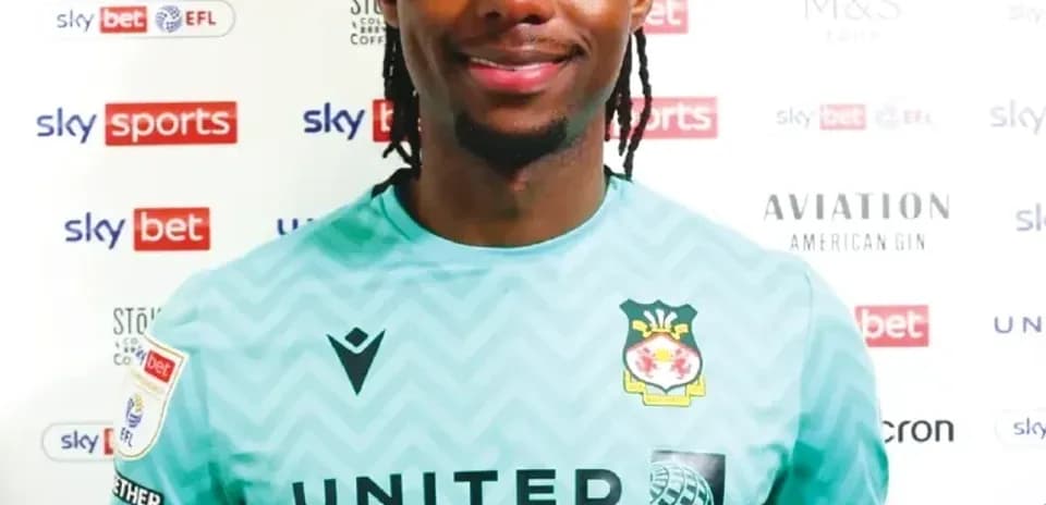 Goalkeeper posing in team kit for photo