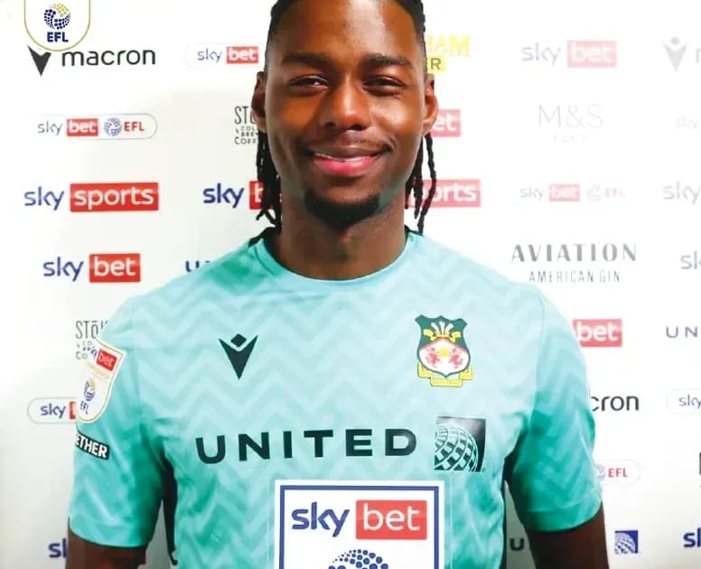 Goalkeeper posing in team kit for photo