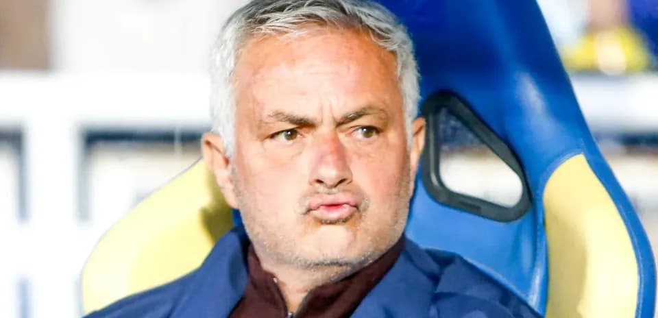 Coach sitting on the bench during a match