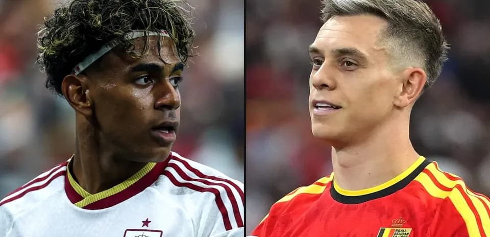 Two football players from Spain and Belgium during match