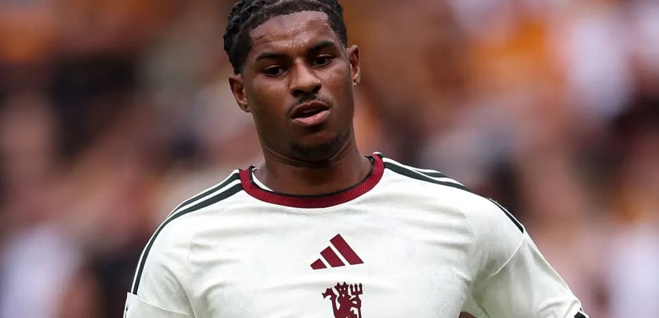 Player wearing white jersey during match action