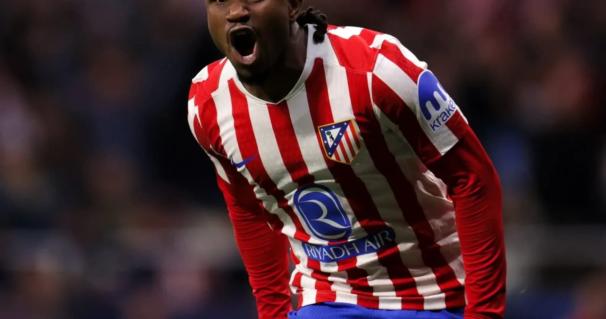 Player celebrating after scoring a goal for Atlético Madrid