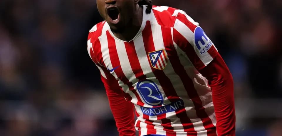 Player celebrating after scoring a goal for Atlético Madrid
